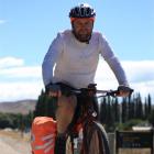 Queenstown man Carey Vivian  near Chatto Creek on day 29 of his length of the country bike ride....