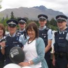 Queenstown Police show their support for White Ribbon Day on Wednesday. Pictured front, from left...