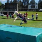 Queenstown Primary School's Jack Turner (8) competes in the boys under 10 1m high jump, at the...
