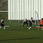 Queenstown Rovers (in black) on defence against Dunedin team Northern.  Photo by Christina McDonald.