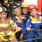 Queenstown Volunteer Fire Brigade firefighter Andrew Bary with sons George (10), William (4) and...
