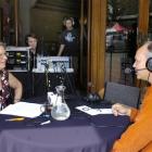 Radio New Zealand announcer Eva Radich interviews musician Trevor Coleman outside the Regent...