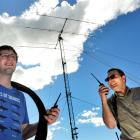 Radio technicians (from left) Adam Campbell, of Balclutha, and Stewart Hall, of Dunedin, complete...