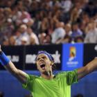 Rafael Nadal of Spain celebrates after defeating Roger Federer of Switzerland in their semifinal...