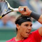 Rafael Nadal of Spain returns the ball to Denis Istomin of Uzbekistan during their match at the...
