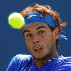 Rafael Nadal of Spain returns to Gilles Muller of Luxembourg during their match at the US Open in...