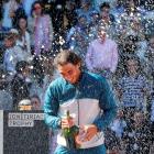 Rafael Nadal of Spain sprays champagne after winning the Madrid Open final against Stanislas...