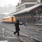 A pedestrian cuts across the railway lines next to the Dunedin Railway Station yesterday. Photo...