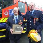 Raymond Burleigh and his father Bruce Burleigh at the Milton fire station. Including the service...