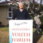 Recently retired youth worker Jim de Thierry, of Alexandra, with a sign from his days working in...