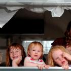 Recovering in their caravan in Dunedin yesterday after a windy night are the Richmond family ...