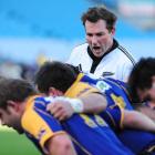 Referee Glen Jackson barks out instructions at a scrum at Carisbrook on Saturday. Photo by Craig...