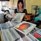 Relics music store assistant Sarah Williamson unpacks a collectable Bob Dylan album boxed set...