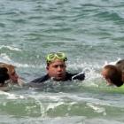 Brighton Surf Life Saving Club and Water Rescue squad members surround Shane Hale. Photo by...