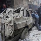 Residents look for survivors after what activists said was an air strike from forces loyal to...