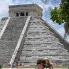 Restored to its former grandeur on two sides, the central pyramid dominates the archaeological...