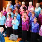 Retiring Dunedin Star Singers' musical director Dulcie Gunn (front) accepts applause at Knox...