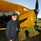 Returned serviceman Mack Swinburn (93), of Waipukurau, prepares for a flight in a Tiger Moth. ...
