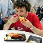 Richard Geeves takes a bite of his crayfish at the inaugural Port Chalmers Seafood Festival on...