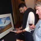 Richard Magides, of Singapore, and Murray Cockburn, of Queenstown, take in the New Zealand art on...