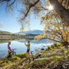 Riders pause for a photo during an autumn ride on the Lake Hayes Circuit. Photo by Miles Holden.