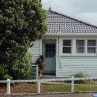 Ridiculous vacancy . . . John Parker and Theresa Crosbie in Meridian St, Port Chalmers, outside a...