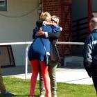 Ridley's trainer, Joanne Hillis (facing camera), gets a hug from Otago Racing Club committee...