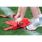 Instead of potentially dangerous tackling, players rip sticky ribbons from their opponents.