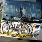 Ritchies bus driver David Lott drives up  Brockville Rd yesterday with two bicycles on a custom...