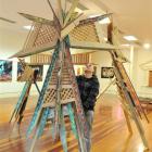 Riverton artist Chris Flavell with his Maori kite sculptures at the Dunedin Community Gallery....