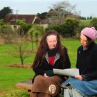 Robin Swanney-Macpherson (left) and Juliet Novena Sorrel discuss plans for a heritage orchard in...