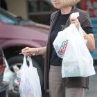 Robyn Jephson with some plastic shopping bags, for which supermarket chains will charge 5c per...