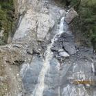 Rocks the size of houses perched above State Highway 6 near Haast, are slowing down clearing of...