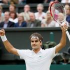 Roger Federer of Switzerland celebrates after defeating Novak Djokovic of Serbia in their men's...