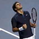 Roger Federer of Switzerland celebrates winning the men's singles final against Jo-Wilfried...