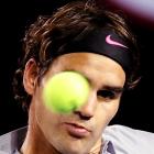 Roger Federer of Switzerland watches the ball during his men's singles match against Bernard...
