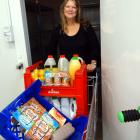 FoodShare manager Pip Wood wheels another load of food from the chiller. The organisation needs...