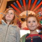 Romahapa sisters Cassie (7, left) and Joss (6)  Winslade  show off their masks at last night's...