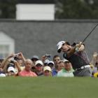 Rory McIlroy, of Northern Ireland, tees off on the first hole during a practice round yesterday...