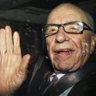 Rupert Murdoch is driven away from News International headquarters in Wapping, east London.(AP...