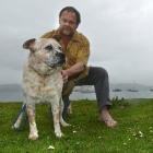 Russell Davidson with blind cattle dog Jemma at Deborah Bay yesterday. Photo by Stephen Jaquiery.