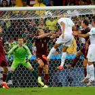 Russia's goalkeeper Igor Akinfeev (2nd L) waits as Algeria's Islam Slimani heads towards goal....