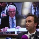 Russia's permanent representative to the United Nations Vitaly Churkin (on the screen) presides...