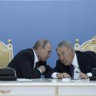Russian President Vladimir Putin (left) and his Kazakh counterpart Nursultan Nazarbayev at a...