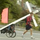 Ryan Craig of Oamaru carrying his cross. Photo by Peter McIntosh.