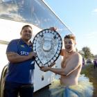 Ryan Hammer (23) is rewarded for his attempts to get close to the players and the Ranfurly Shield...