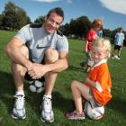 Ryan Nelsen with 4-year-old Lucy Vink at the Cashmere Wanderers Soccer Club in Christchurch...