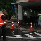 S.J. Allen Wakatipu waste disposal owner Simon Spark hoses down the Queenstown KFC drive-through...