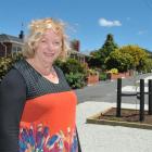 Saddle Hill Community Board deputy chairwoman Pam Jemmett admires landscaping on Main Rd, as part...