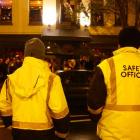 Saftey Patrol officers Pat Wall (left) and Grahame Fox watch closely as the crowd grows in the...